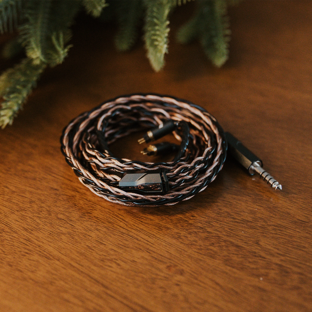 Effect Audio Christmas 2025 cable coiled with christmas tree on wooden table