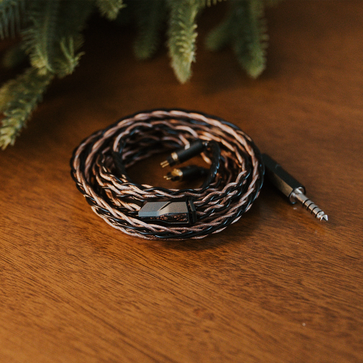 Effect Audio Christmas 2025 cable coiled with christmas tree on wooden table