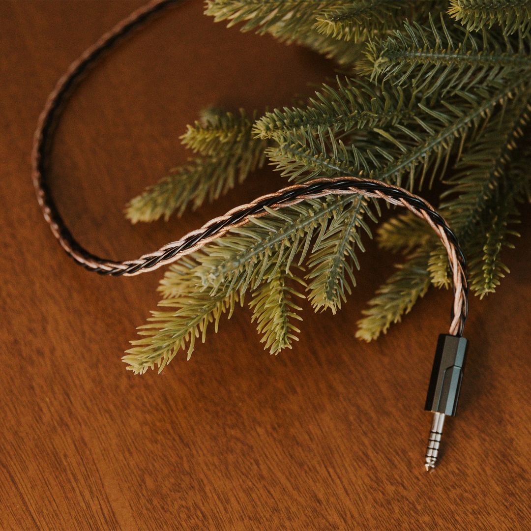 Effect Audio Christmas 2025 cable lying on with christmas tree on wooden table