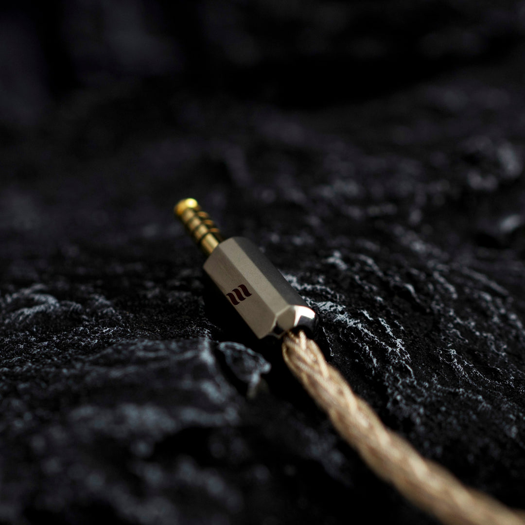 Effect Audio Centurion cable closeup of Pentaconn plug over dark textured background