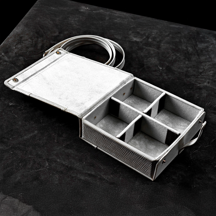 Eletech Canvas Companion Case sitting open view of compartments on black table