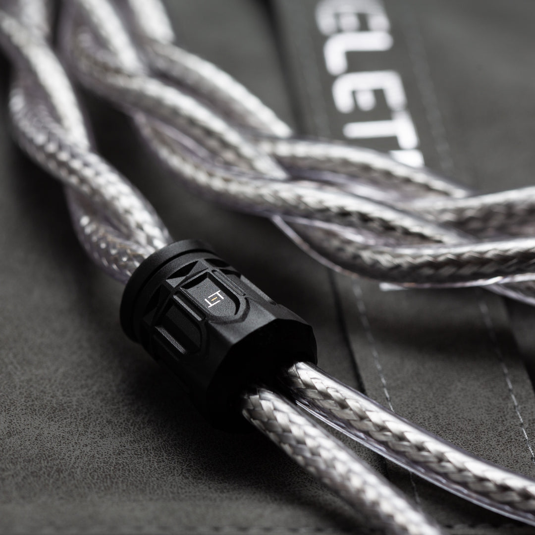 Eletech Purgatorio closeup Y-split and dual Silver cable strands over included folding pouch