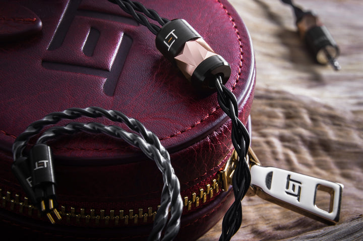 Eletech Socrates on burgundy leather case highlighting y-split, zipper, and 2-pin connectors