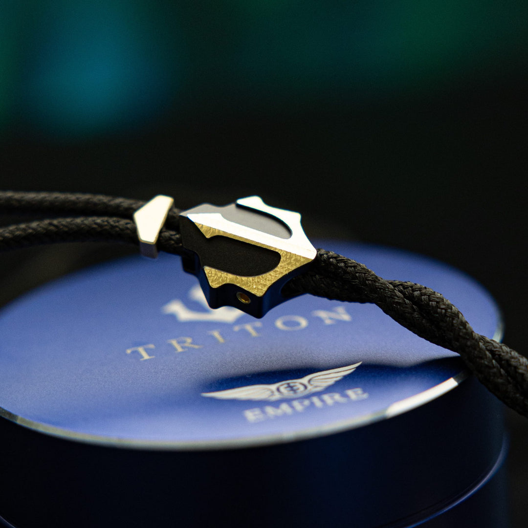 Empire Ears Triton LE cable highlighting y-split over blue metal EE case