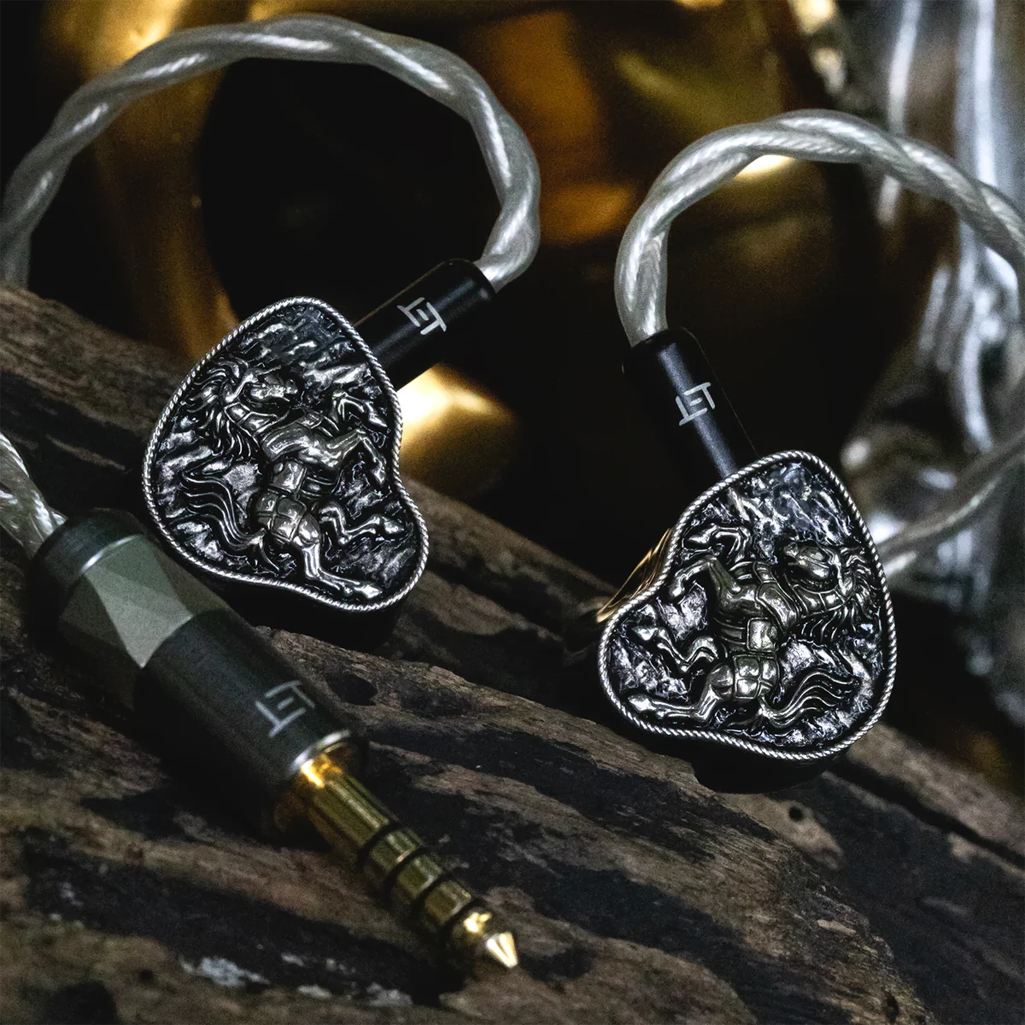 FlipEars Arion IEMs sitting on wood piece front view attached to cable