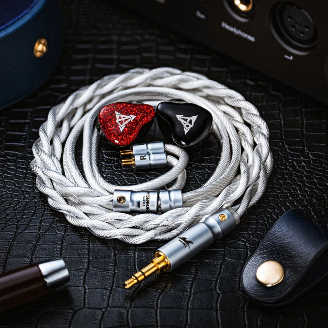 Hisenior Mega5-EST Bass+ iems coiled in cable sitting on black leather with accessories around