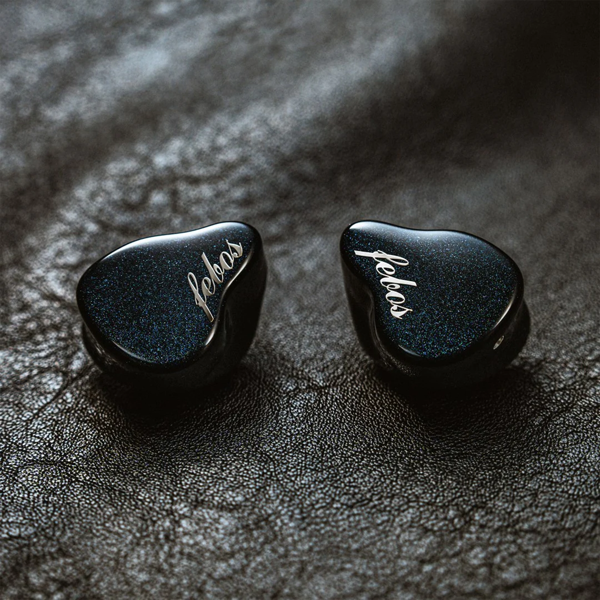 Hisenior Mega5-EST 7th anniversary iems sitting on leather background