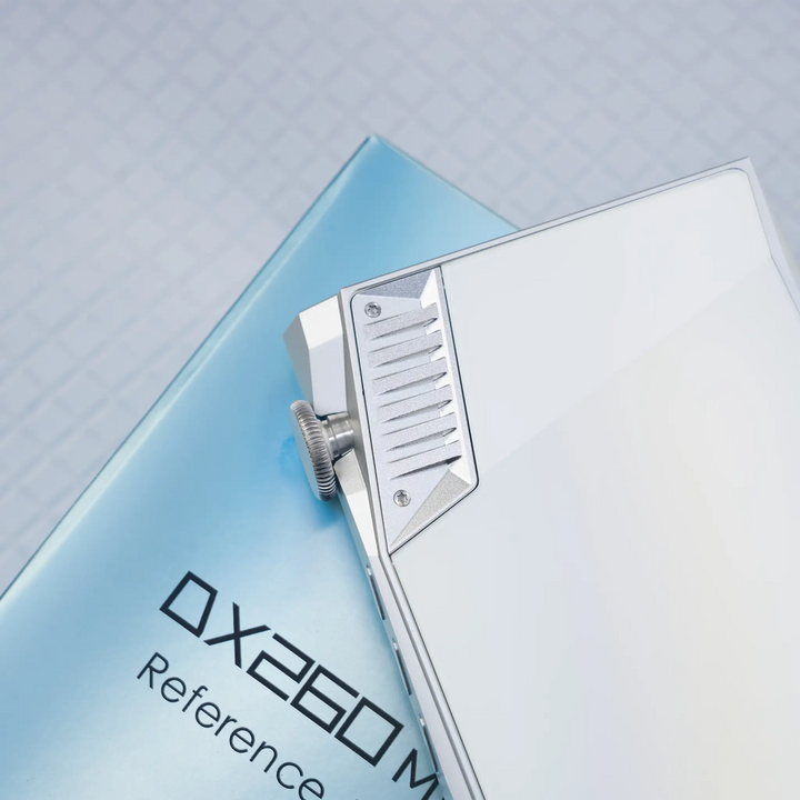 iBasso DX260MK2 DAP in white silver face down closeup of volume wheel with product box