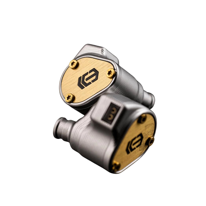 Ice Lab Lumira IEMs with brushed silver metal bodies and gold-plated accents, featuring a black logo on the gold plates and gold screws, shown on a solid white background.