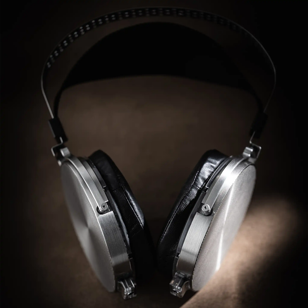 Moondrop Para 2 headphones lying center on brown textured backdrop