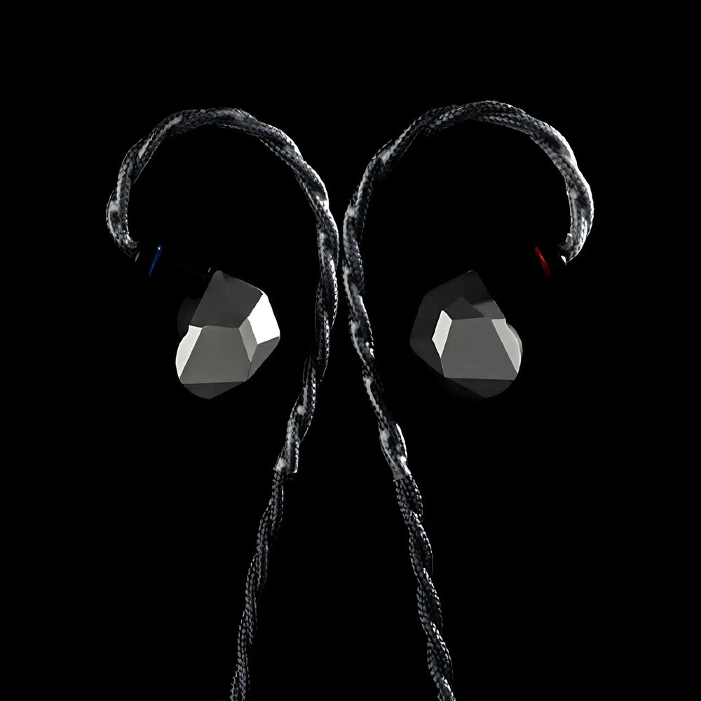 Moondrop Harmon IEMs front center attached to cable on black background