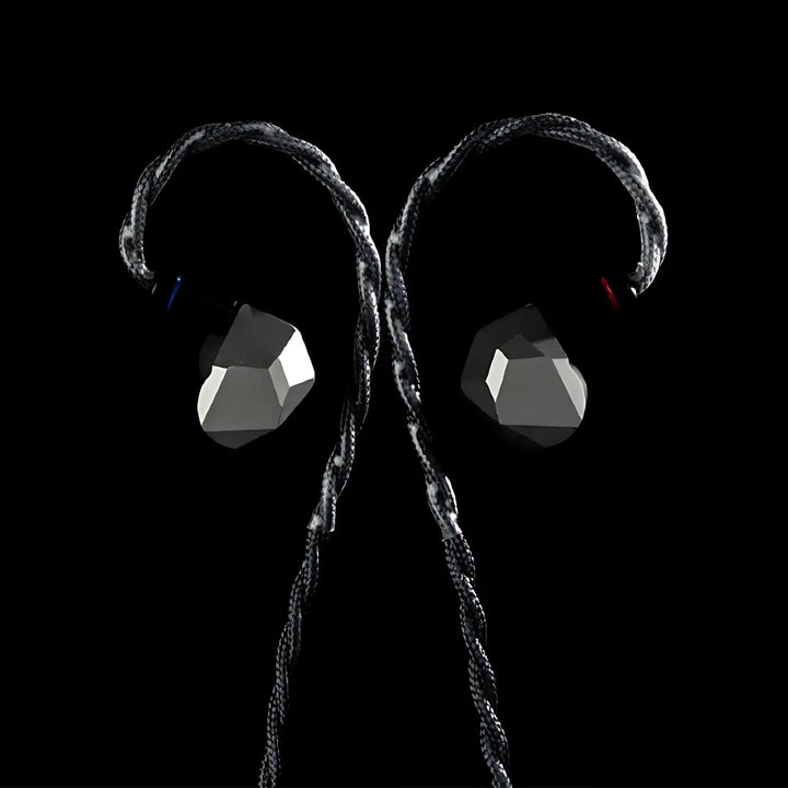 Moondrop Harmon IEMs front center attached to cable on black background