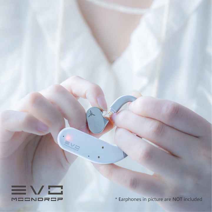 human holding and connecting MoonDrop EVO to earphone