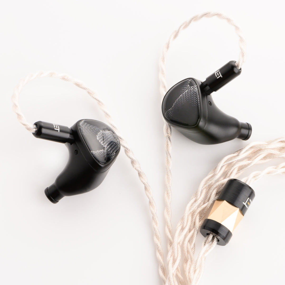 Noble Audio Onyx front quarter bird's eye with attached stock cable over white background