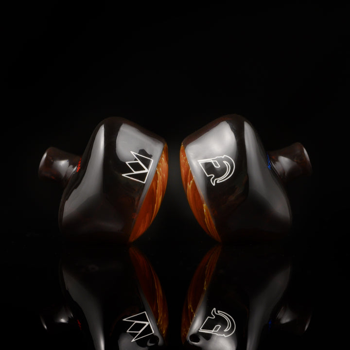 Noble Audio Spartacus IEM rear highlighting brand etchings over black reflective background