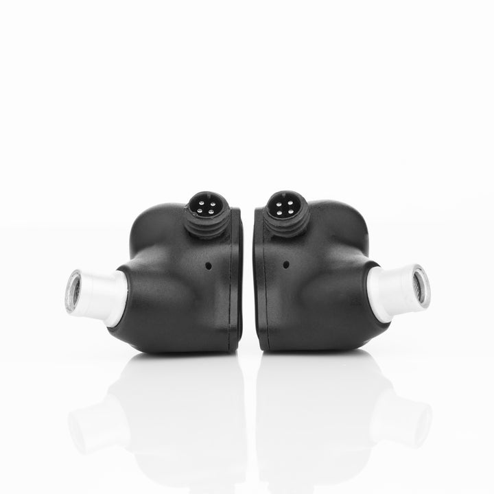 Noble Audio XM-1 rear highlighting connectors and bores over white reflective background