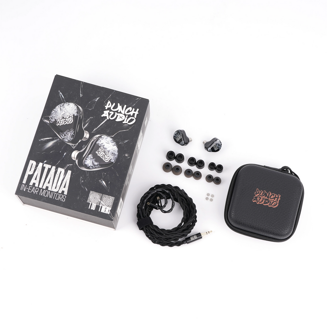 Punch Audio Patada in-ear monitors shown with their retail box, a black braided cable, multiple black ear tips, and a black zippered carrying case on a white background.