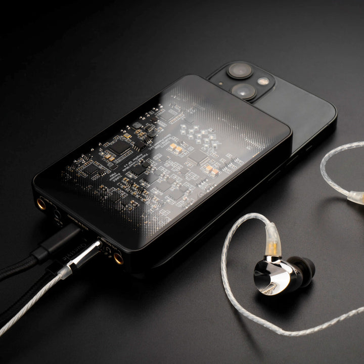 Questyle CMA18 Portable front 3 quarter with attached earphones connected to iPhone