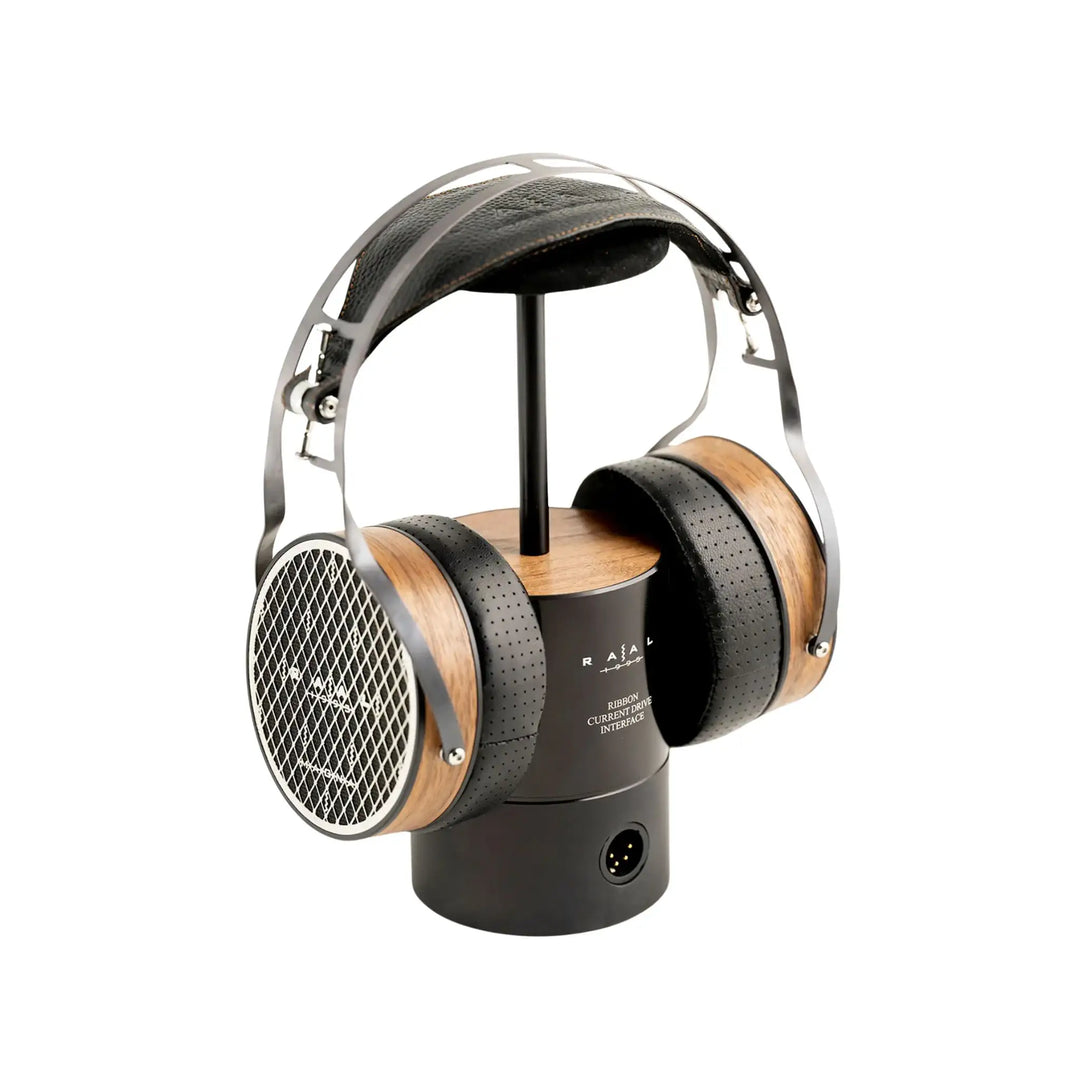 Raal 1995 Magna headphones sitting on Ribbon interface stand front left 3 quarter angle whitebox