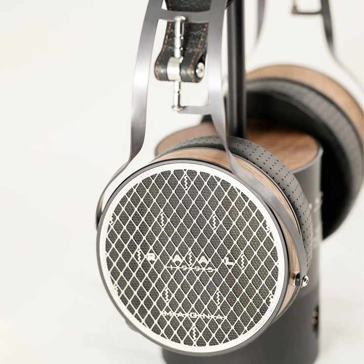 Raal 1995 Magna headphones sitting on ribbon interface stand side view closeup of ear cup whitebox