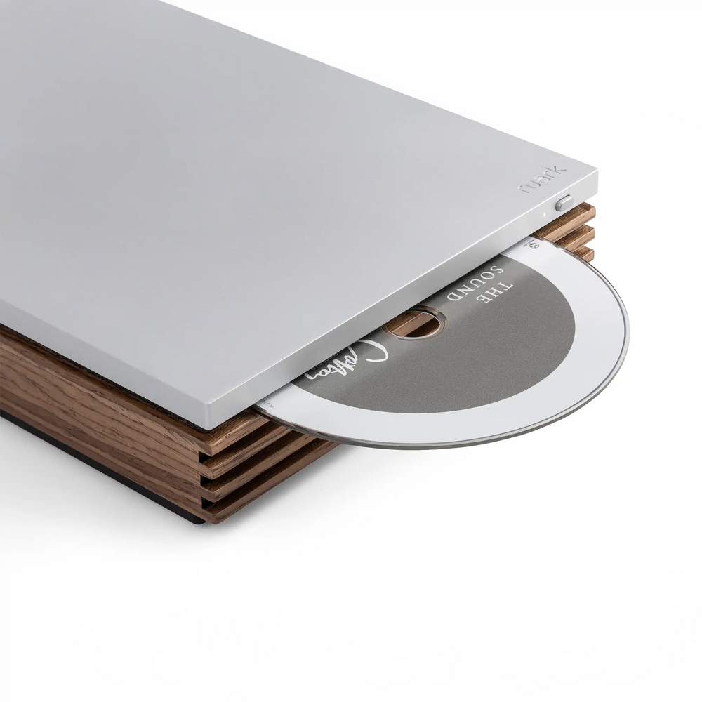 Ruark Audio R-CD100 player sitting front right 3 quarter closeup of cd popping out whitebox