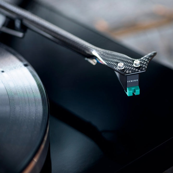 Sumiko Olympia mounted on turntable tonearm hovering over vinyl