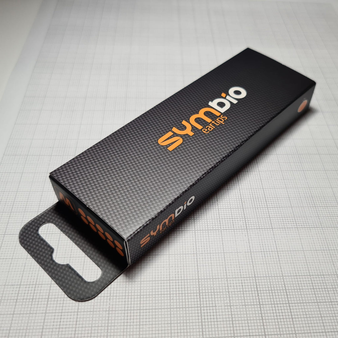 Symbio W retail package over graph paper