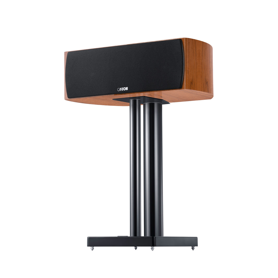 Canton Vento 50 center speaker natural walnut 3 quarter on stand with grille over white background