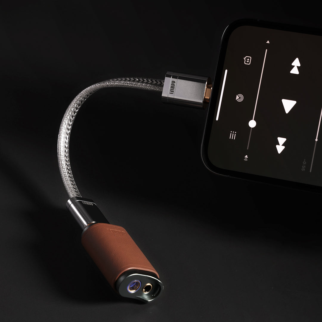 ddHiFi USB Lightning to USB-C cable connected to iPhone and DAC over dark background