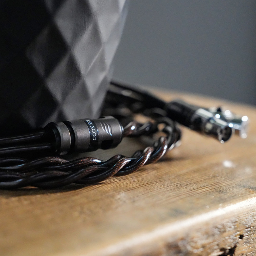 Effect Audio Code 23 cable coiled on wooden shelf from Bloom Audio gallery