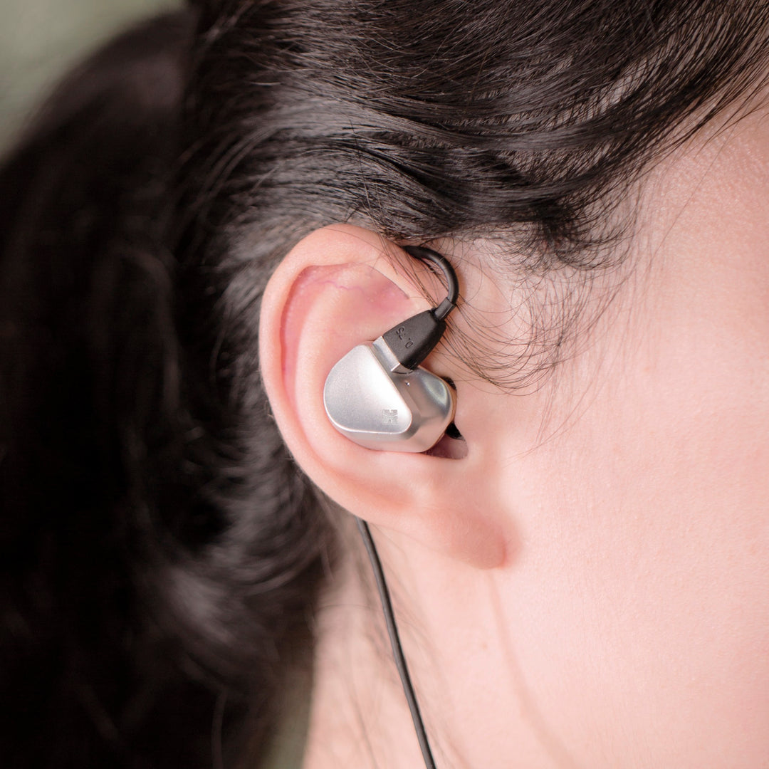 Person wearing HiFiMAN Svanar earphones highlighting fit