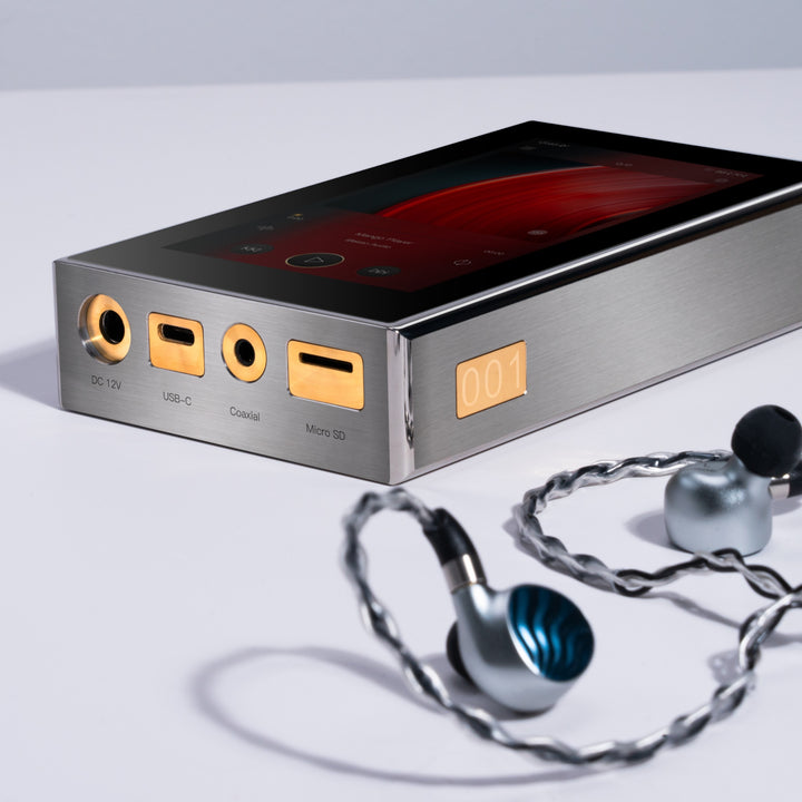 iBasso DX320 MAX Ti 3 quarter top left with detached earphones